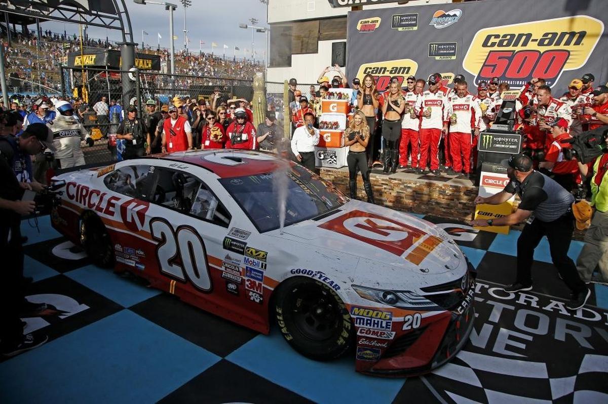 Matt Kenseth drives into Victory Lane after winning Sunday’s Cup Series playoff race at Phoenix International Raceway in Avondale, Ariz.