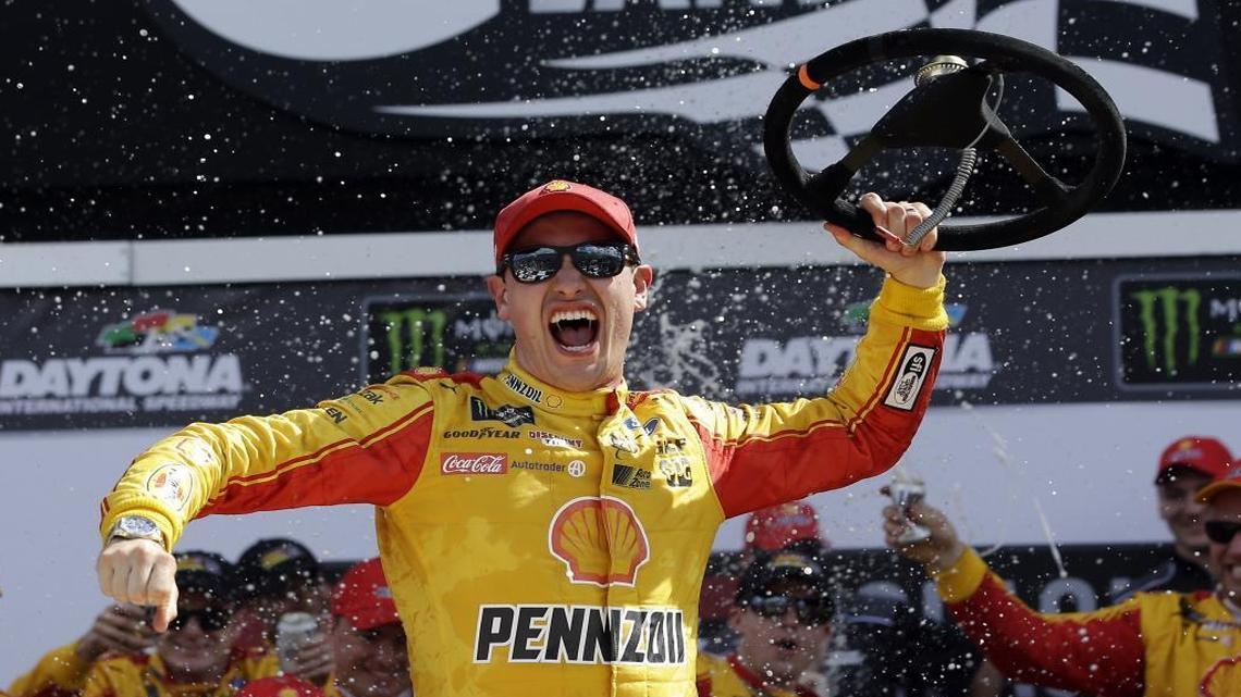 Joey Logano celebrates after winning Sunday’s Advanced Auto Parts Clash at Daytona International Speedway.