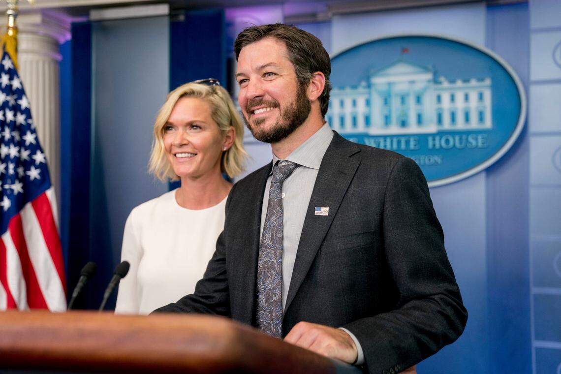 2017 NASCAR Cup champion Martin Truex Jr., and his long time girlfriend Sherry Pollex pose for a photograph together in the press briefing room of the White House in Washington, Monday, May 21, 2018. (AP Photo/Andrew Harnik)
