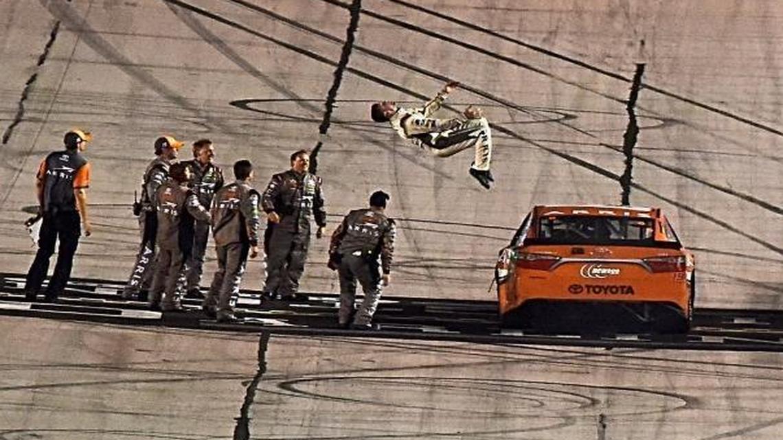 Carl Edwards, driver of the No. 19 Toyota, celebrates with a backflip after winning the NASCAR Sprint Cup Series Bojangles’ Southern 500 at Darlington Raceway last September.