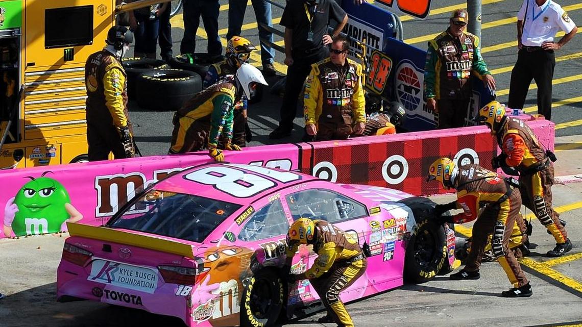 
NASCAR Sprint Cup Series driver Kyle Busch's pit crew work to make repairs to the car after he was involved in an accident with driver Kyle Larson entering pit road during the Bank of America 500 at Charlotte Motor Speedway in Concord, NC on Sunday, October 11, 2015. 
