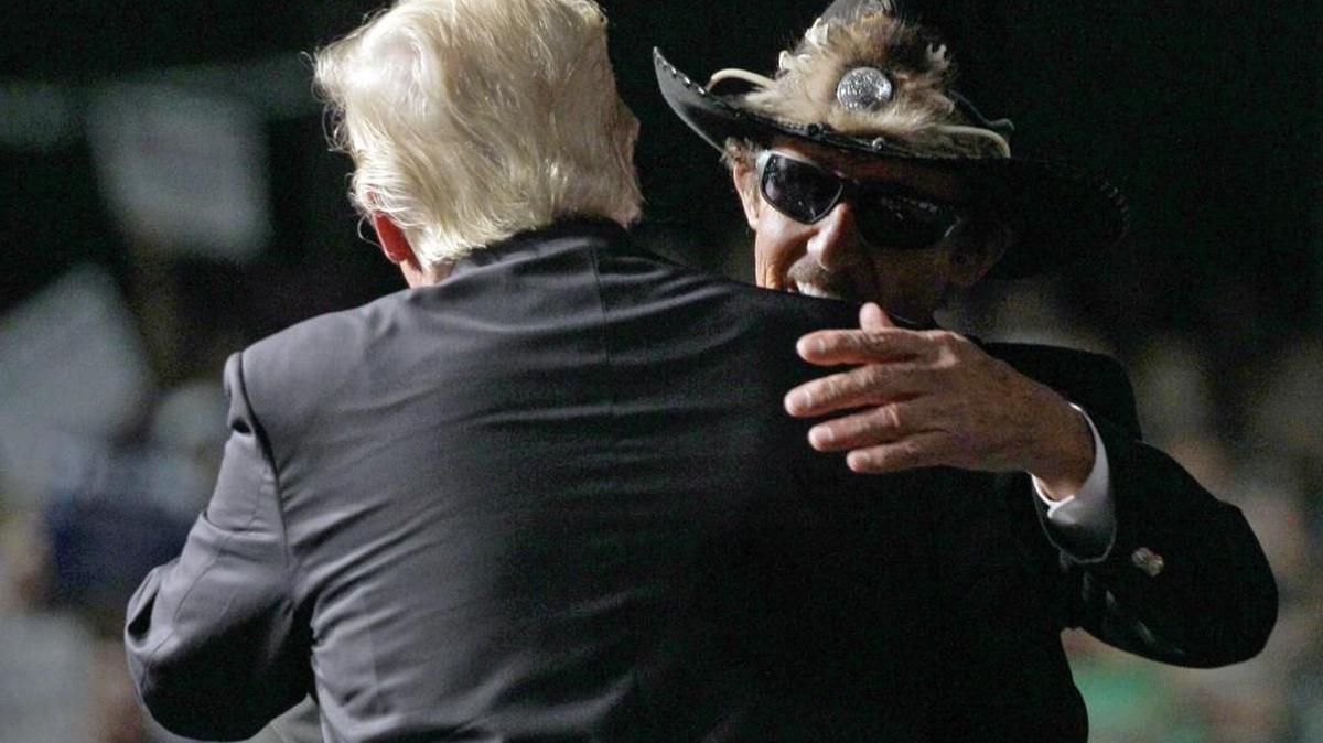 NASCAR great Richard Petty, right, hugs Republican presidential candidate Donald Trump during a campaign rally at the Greensboro Coliseum in June.