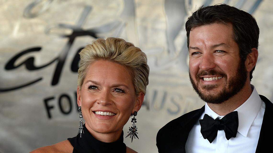 Sherry Pollex, left and her boyfriend NASCAR driver Martin Truex Jr., right pose for photographs prior to entering the Catwalk for a Cause casino night and charity event at the Statesville Municipal Airport on Wednesday, May 18, 2017. The proceeds are going toward cancer research. Pollex is a cancer survivor.