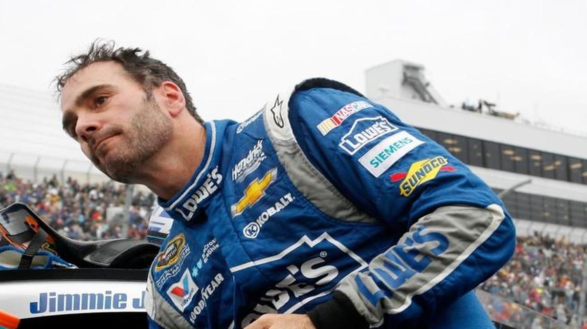
Jimmie Johnson, driver of the 48 Lowe's Chevrolet, climbs out of his car after a disappointing finish at Dover International Speedway on Sunday. 
