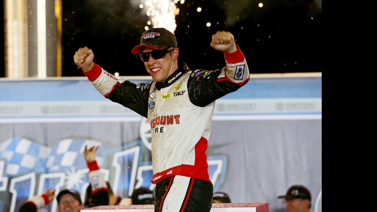 
Brad Keselowski celebrates in Victory Lane after winning Friday’s Kentucky 300 in Sparta, Ky. 
