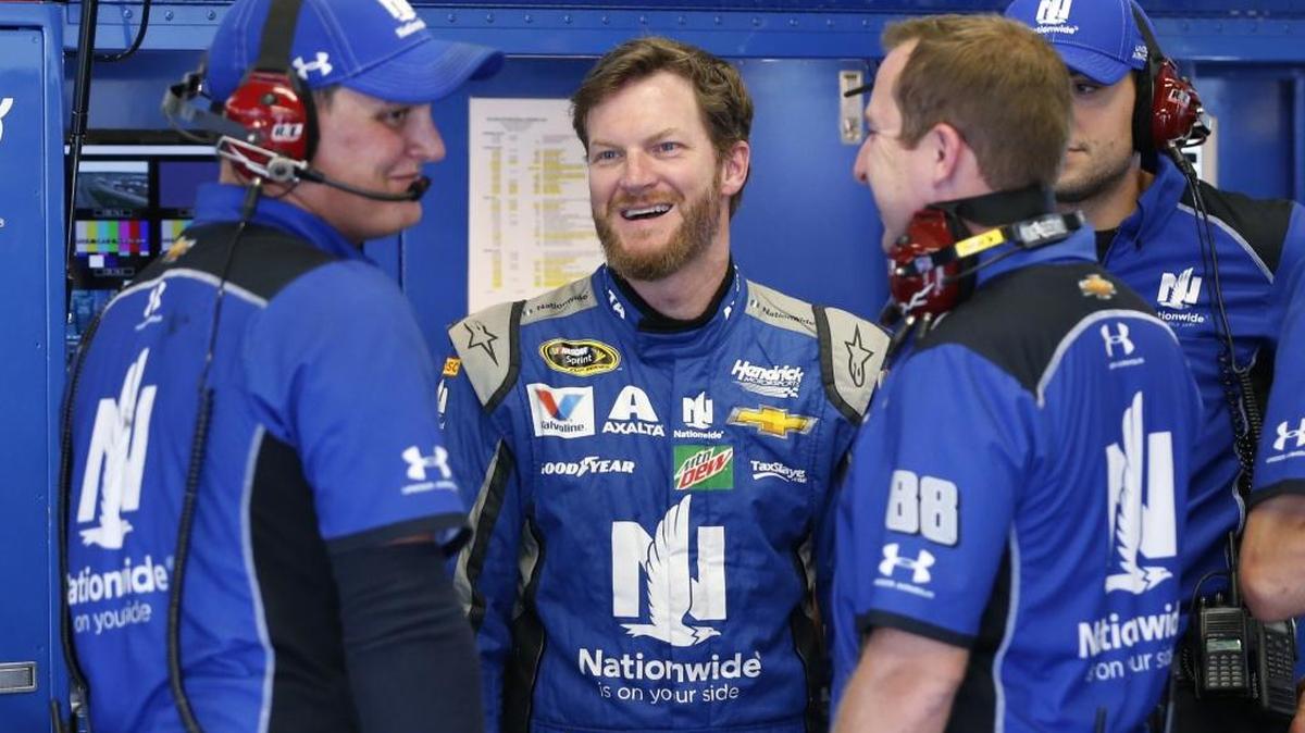 Dale Earnhardt Jr., second from left, chats with his crew in the garage during NASCAR Sprint Cup auto racing practice at Daytona International Speedway on Thursday.