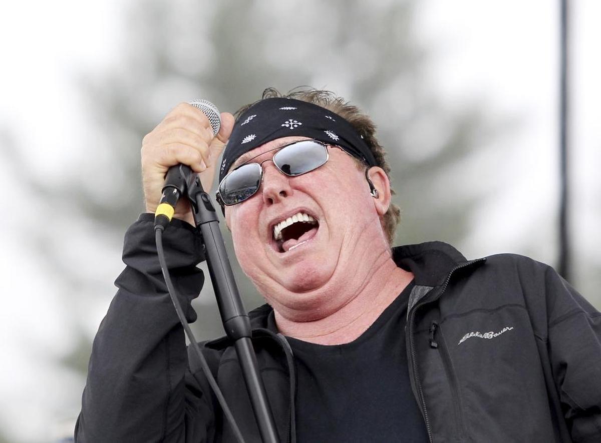 Mike Reno, lead singer of rock band Loverboy (“Turn Me Loose” and “Working for the Weekend”) sings with his band before the start of Sunday’s NASCAR Cup Series auto race at New Hampshire Motor Speedway in Loudon, N.H.