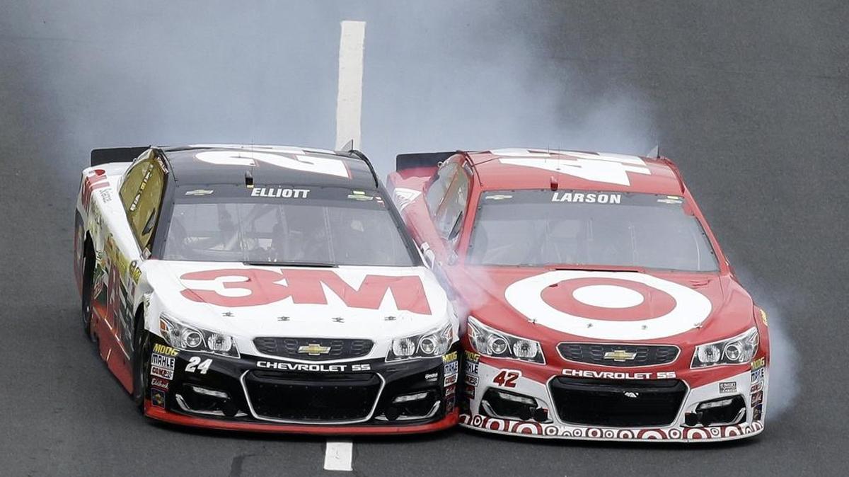 Chase Elliott (left) and Kyle Larson (right) bang their way toward the finish line in the third segment of Saturday’s Sprint Showdown at Charlotte Motor Speedway.