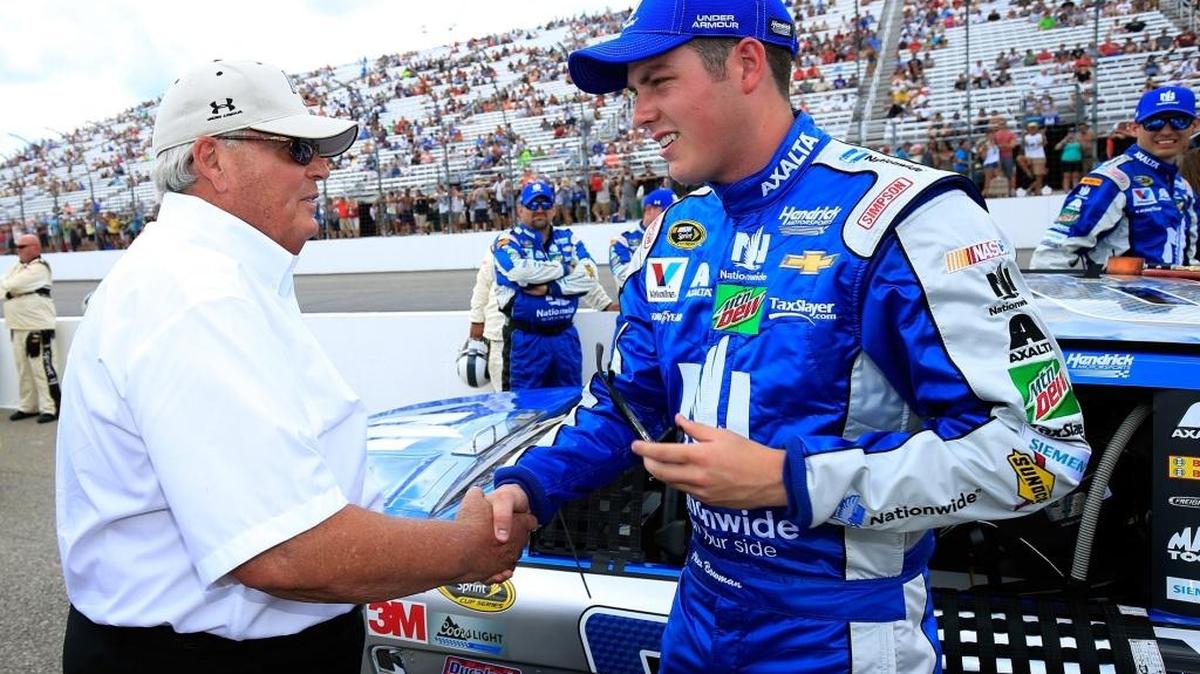 Driver Alex Bowman, right, greets team owner Rick Hendrick before the start of the NASCAR Sprint Cup Series’ New Hampshire 301 in July, the first time Bowman was summoned to fill in for Dale Earnhardt Jr.
