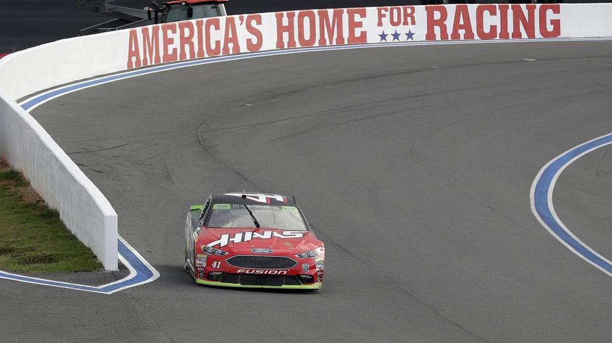 Kurt Busch drives his car out of Turn 2 on Friday during qualifying for Sunday’s Bank of America ROVAL 400 at Charlotte Motor Speedway. Busch won the pole for the NASCAR Cup race.