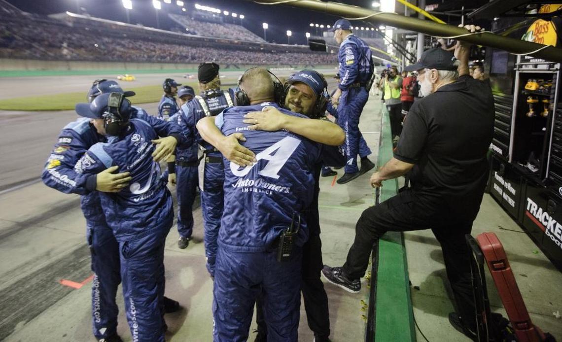 Martin Truex Jr.’s pit crew celebrates after he won Saturday’s Quake State 400 at Kentucky Speedway in Sparta, Ky.