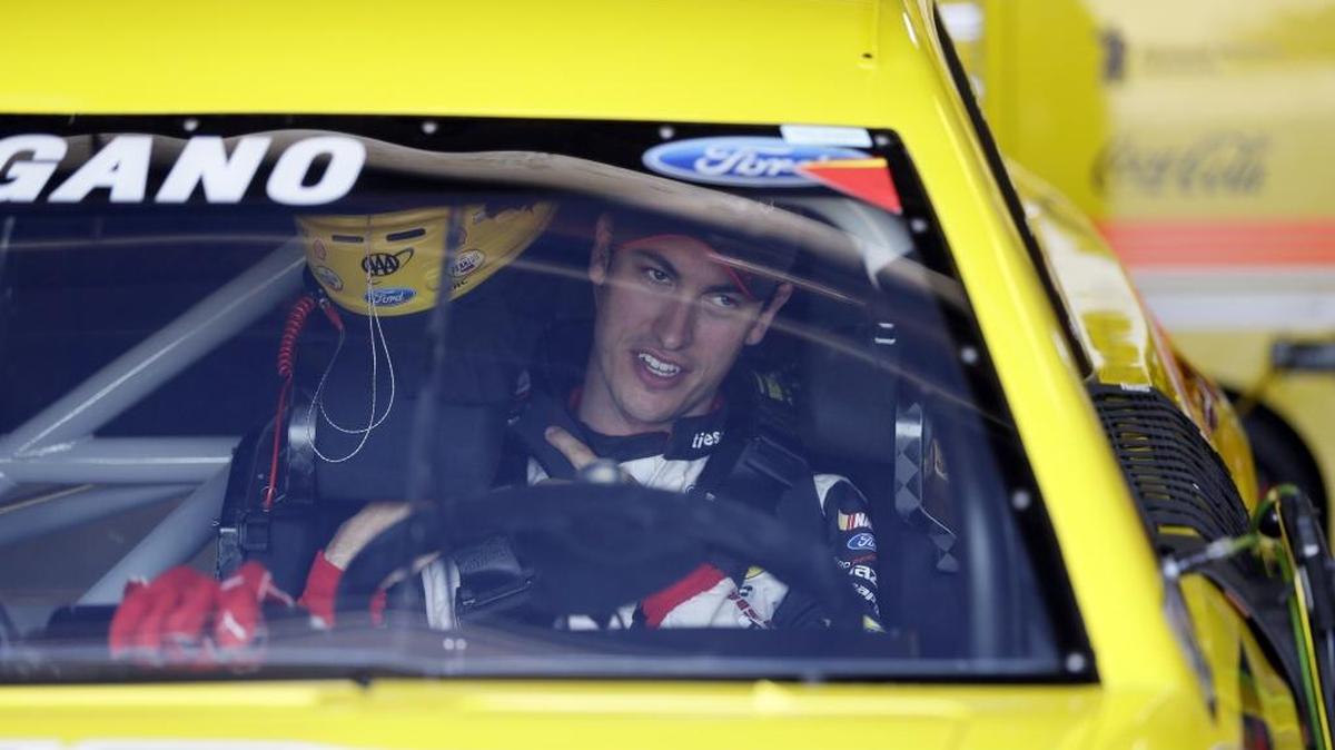Driver Joey Logano prepares for a practice session for the NASCAR Sprint Cup series auto race at Michigan International Speedway, Saturday in Brooklyn, Mich.