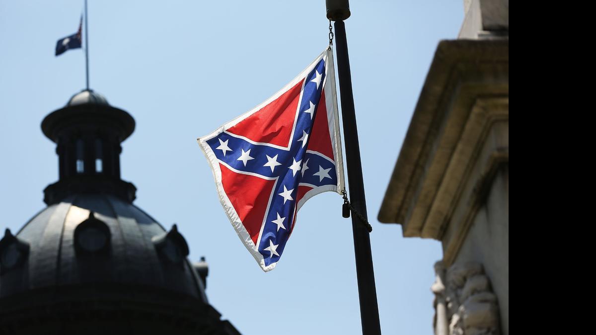 
The Confederate flag is seen flying on the Capitol grounds a day after South Carolina Gov. Nikki Haley announced that she will call for the Confederate flag to be removed on June 23, 2015 in Columbia, South Carolina. NASCAR announced Tuesday its support for Haley’s efforts. 
