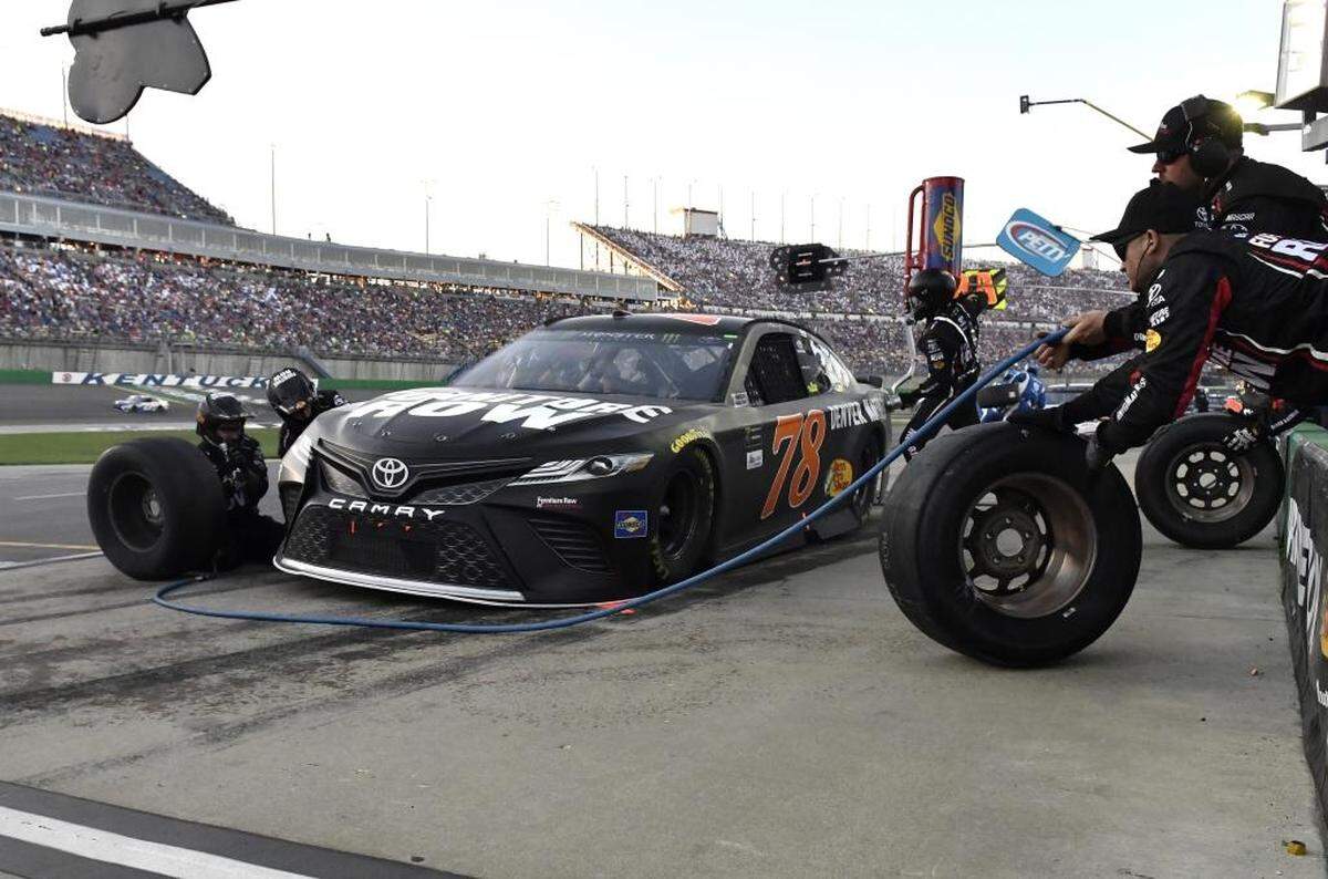 Joe Gibbs Racing supplies the pit crew for the No. 78 team, seen above at Kentucky Speedway last month. After crew members from the 78 team argued with the crew chief of the 18 team at Indy, Joe Gibbs suspended two of them.