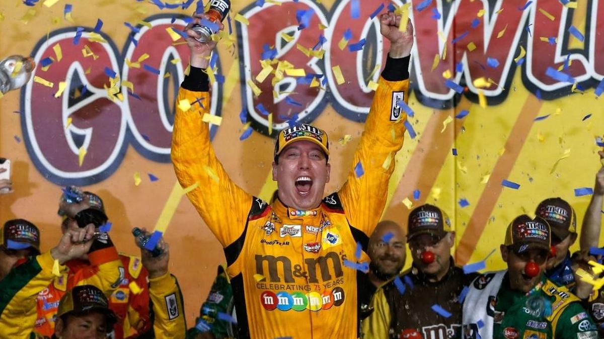 Kyle Busch celebrates Saturday night after winning the Go Bowling 400 at Kansas Speedway on in Kansas City, Kan.