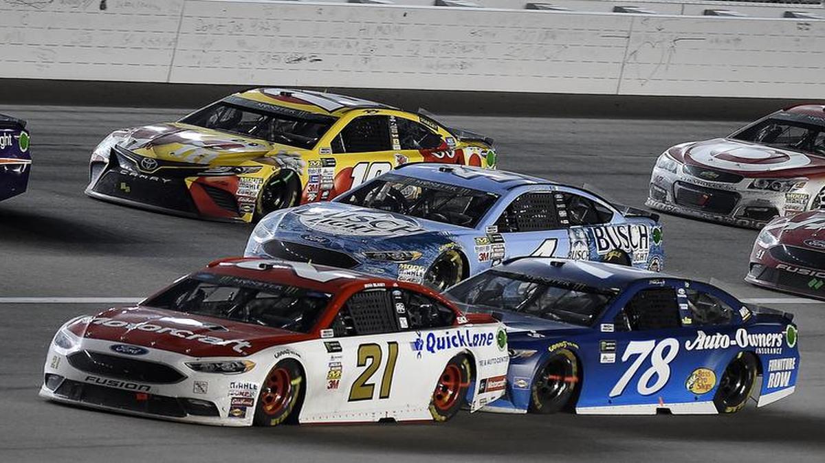 Ryan Blaney (21) was bumped out of the way by Martin Truex Jr. on a late restart in Saturday night’s Go Bowling 400 at Kansas Speedway. Truex went on to win the race, and Blaney ended up fourth.