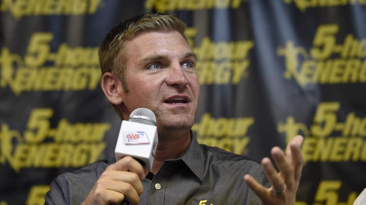
Clint Bowyer speaks during a press conference where it was announced he will race for HScott Motorsports in the 2016 season, Friday, Oct. 2, 2015, at Dover International Speedway in Dover, Del. The NASCAR Sprint Cup series auto race is scheduled for Sunday. 

