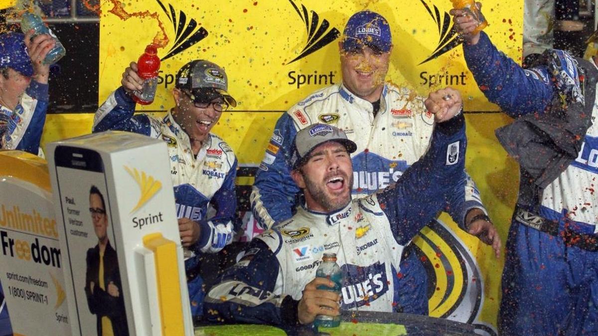 Jimmie Johnson, center, celebrates after winning the 2016 Ford EcoBoost 400 and his seventh NASCAR Cup Series championship at Homestead-Miami Speedway. Richard Petty and the late Dale Earnhardt are NASCAR’s only other seven-time Cup champions.
