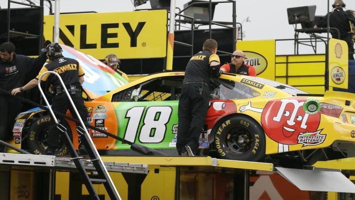 Kyle Busch’s crew unloads a backup car Friday at Texas Motor Speedway after Busch crashed in practice for Sunday’s Texas AAA 500.