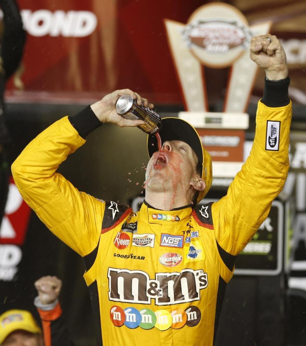 Kyle Busch celebrates after winning Saturday’s NASCAR Cup Series auto race in Richmond, Va. Busch pulled away on a restart in a two-lap overtime sprint to the finish for his third consecutive Cup win.