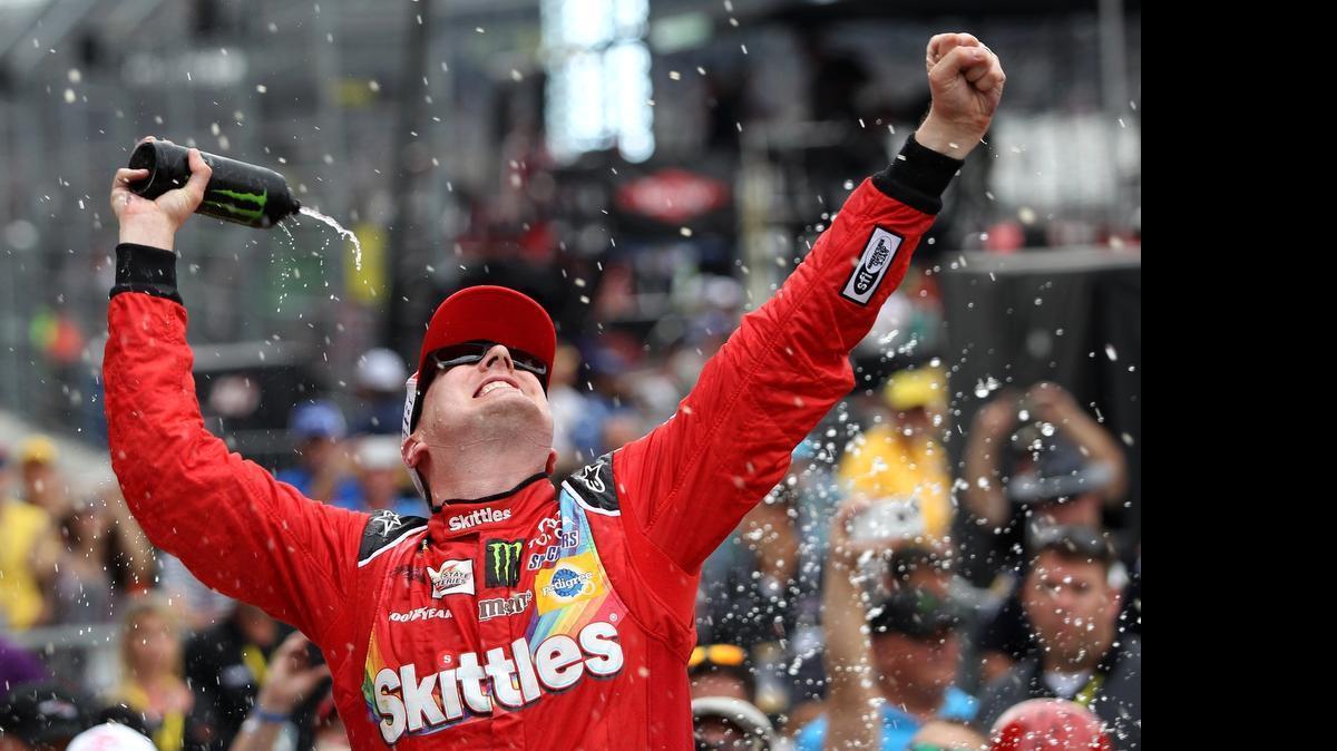 
Kyle Busch celebrates in Victory Lane after winning the NASCAR Sprint Cup Series Crown Royal Presents the Jeff Kyle 400 at the Brickyard at Indianapolis Motor Speedway on July 26, 2015 in Indianapolis.
