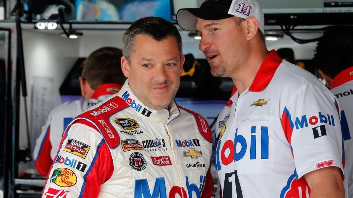 Tony Stewart, left, spoke Sunday for the first time since being fined by NASCAR.