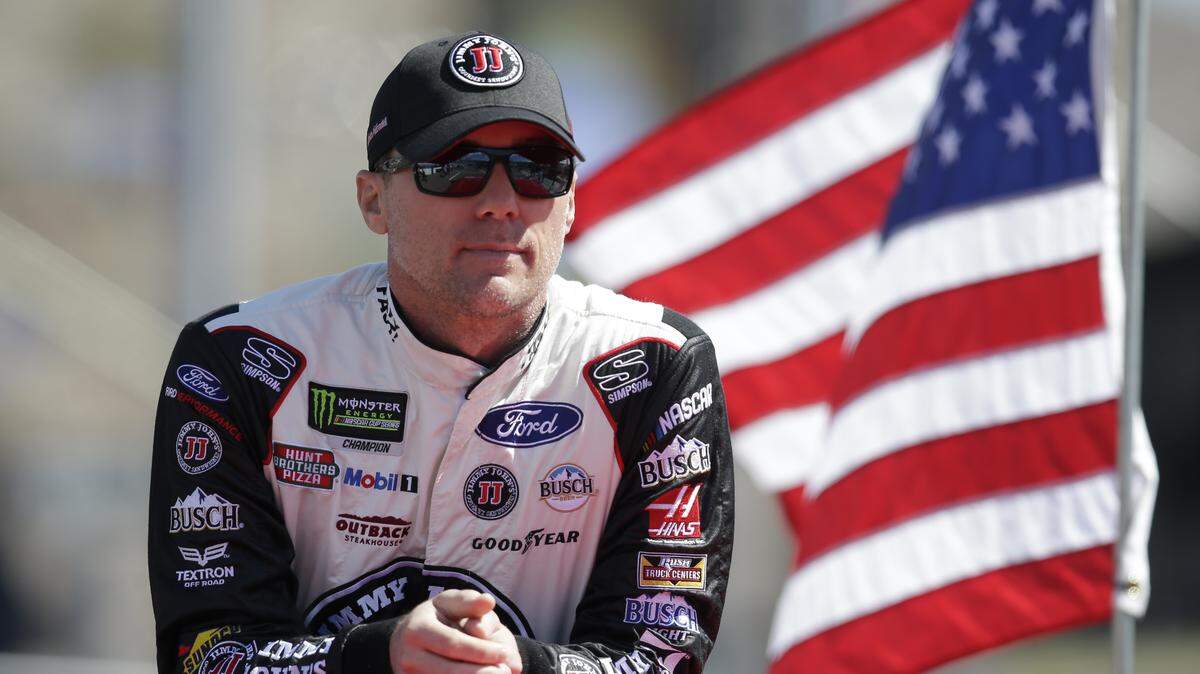 Kevin Harvick (4) stands during a parade lap before a NASCAR Cup Series auto race on Sunday, March 11, 2018, in Avondale, Ariz. (AP Photo/Rick Scuteri)