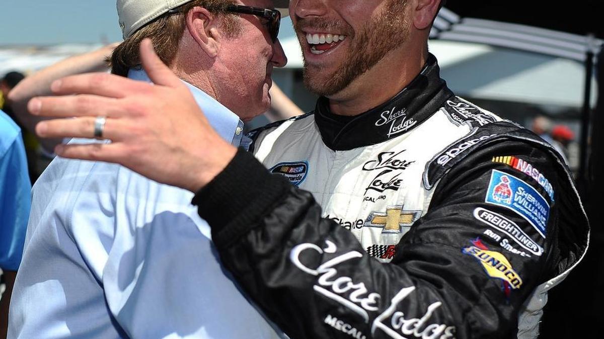 Team owner Richard Childress (left) congratulates Brian Scott after Scott won the pole at Talladega in 2014.