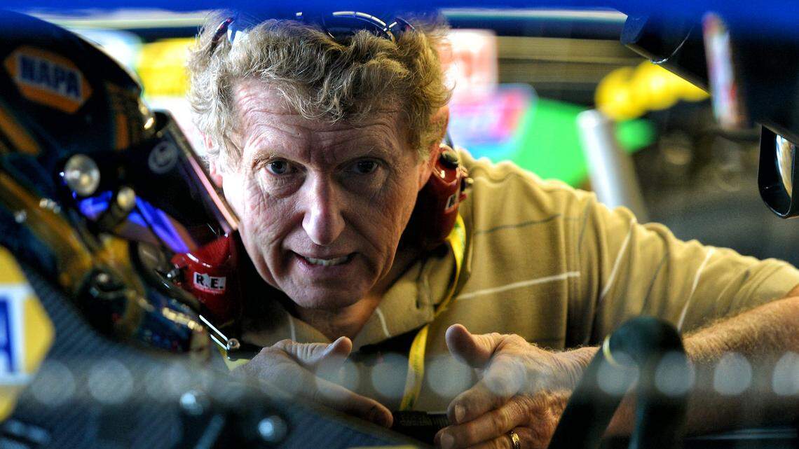Former NASCAR Sprint Cup driver Bill Elliott talks with his son, Chase Elliott (9) in the garage after Chase ran practice laps on Thursday, February 20, 2014 at Daytona International Speedway.