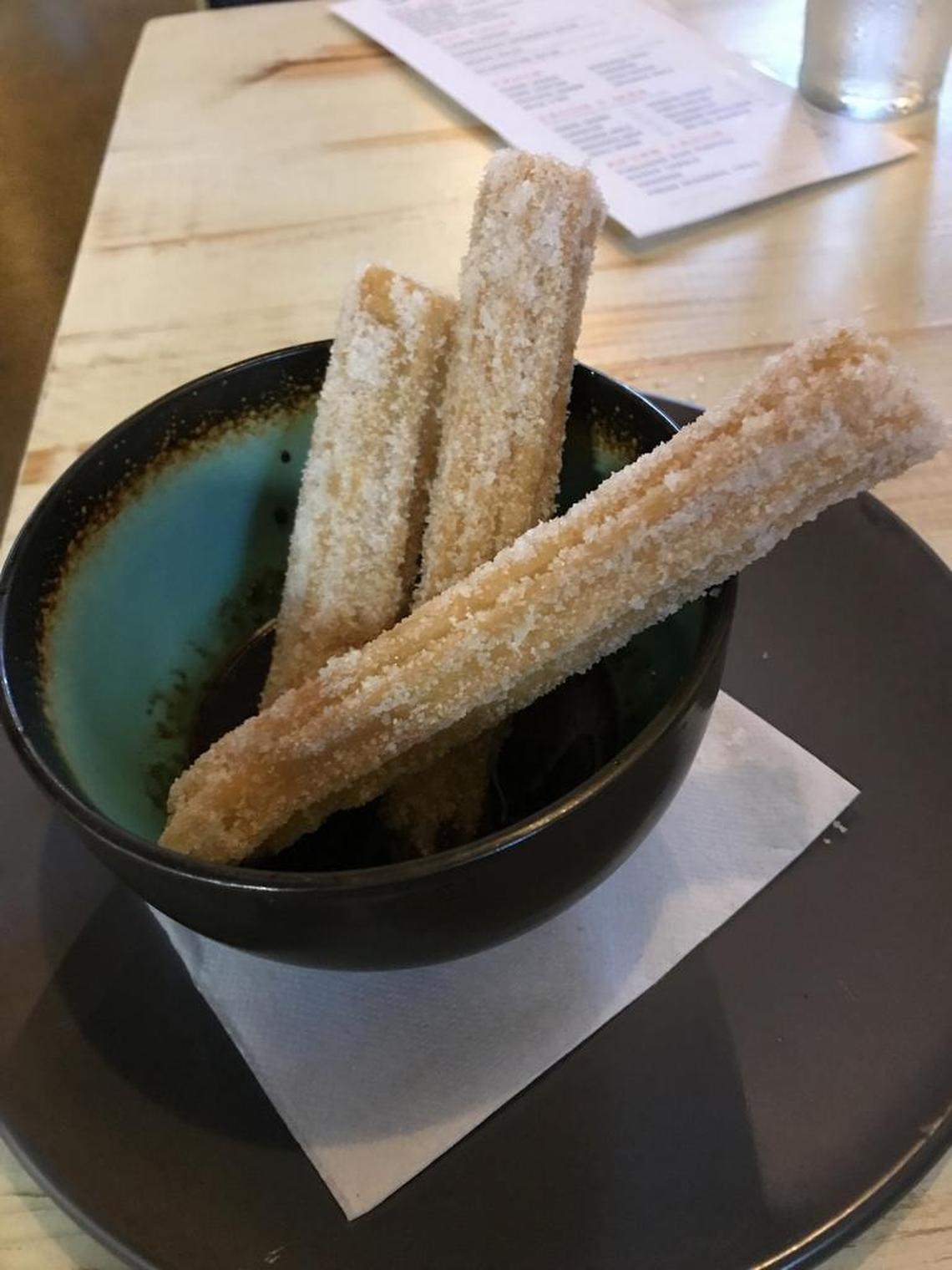 The churros come dunked in a warm chocolate sauce, and the cinnamon sugar coating makes them even better than they would be.