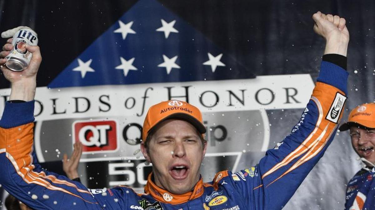 Brad Keselowski celebrates in Victory Lane after winning Sunday’s NASCAR Cup series race at Atlanta Motor Speedway.