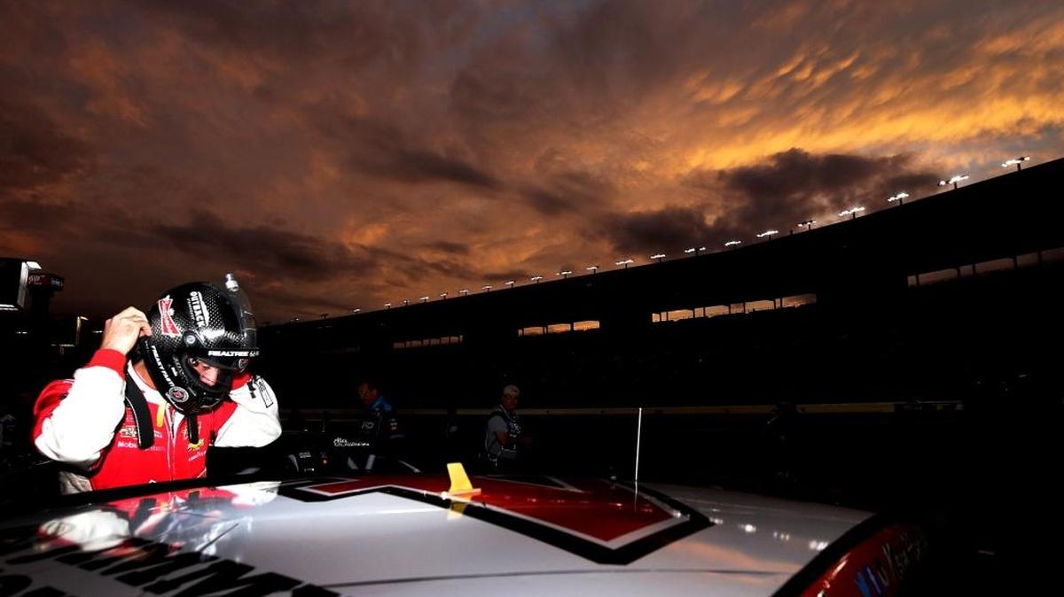 Kevin Harvick stands on the grid during Friday’s qualifying for the NASCAR Sprint Cup Series AAA Texas 500 at Texas Motor Speedway.