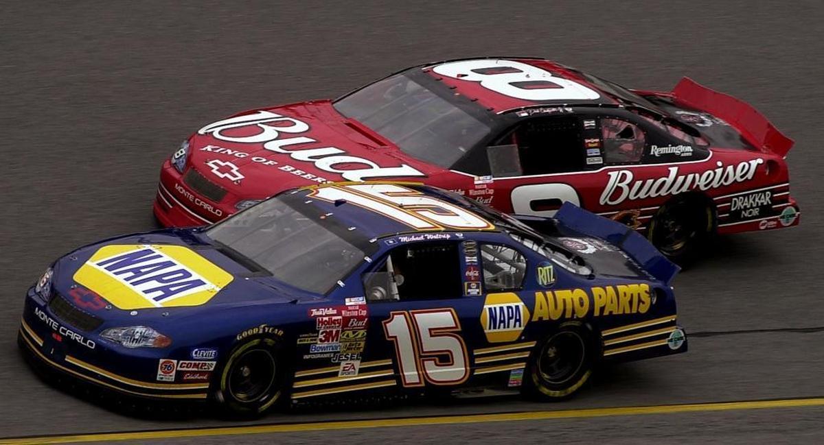 Michael Waltrip and Dale Earnhardt Jr. battle one another on February 13, 2002 during a practice at Daytona International Speedway.