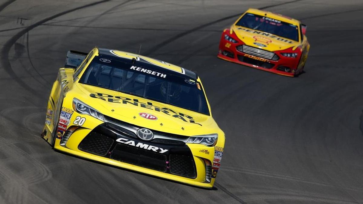 
Matt Kenseth, driver of the #20 Dollar General Toyota, races Joey Logano, driver of the #22 Shell Pennzoil Ford, during the NASCAR Sprint Cup Series Pure Michigan 400 at Michigan International Speedway on August 16, 2015 in Brooklyn, Michigan.

