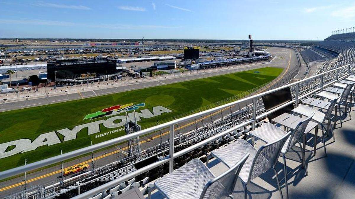Patrons of the Rolex 24 Lounge can exit the indoor area to a patio with chairs to view race activities at Daytona International Speedway.