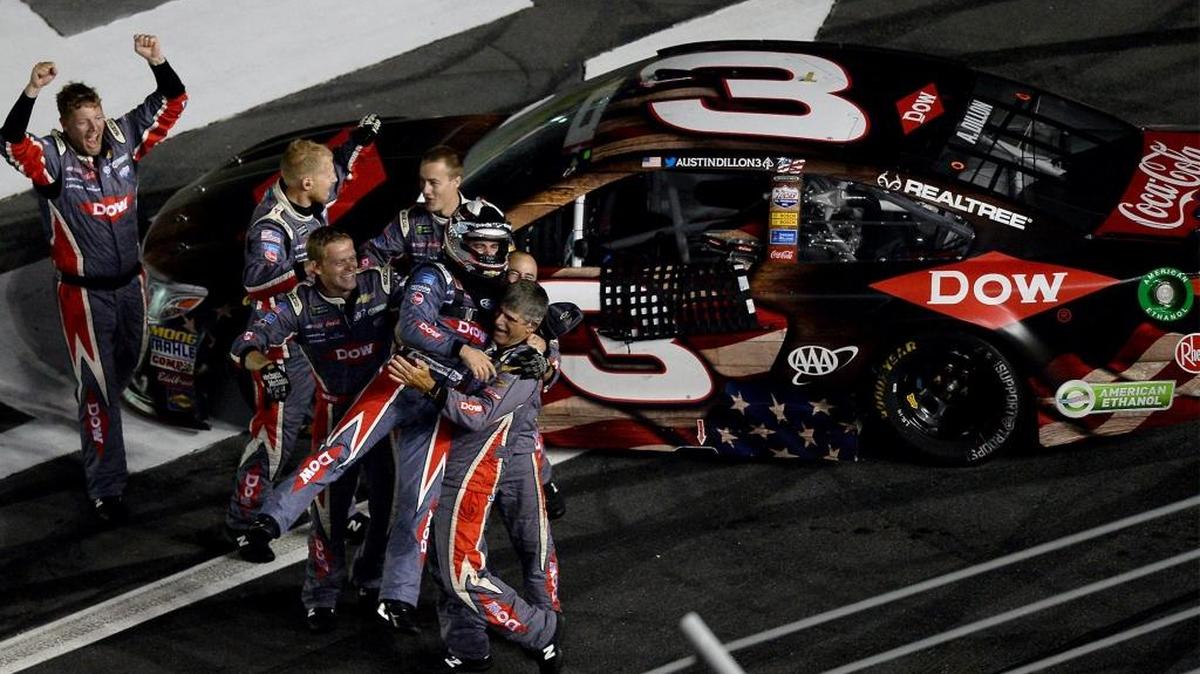 NASCAR driver Austin Dillon is lifted up as he and his team celebrate winning the Coca-Cola 600 at Charlotte Motor Speedway on Monday, May 29, 2017.