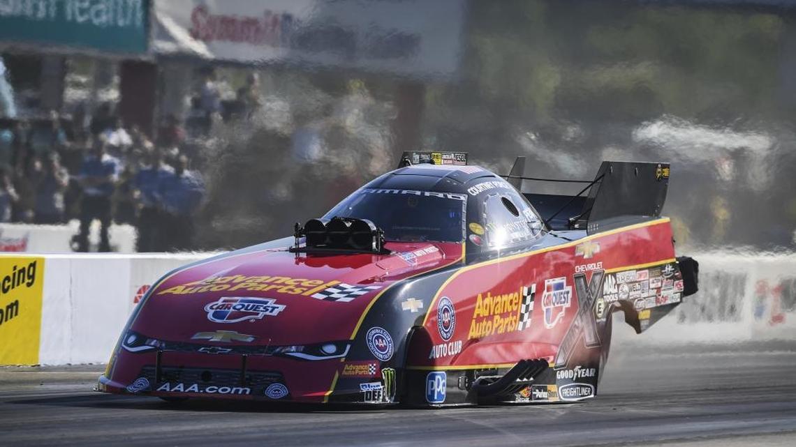 In this photo provided by the NHRA, Courtney Force drives in Saturday’s Funny Car qualifying at the NHRA Four-Wide Nationals drag races at zMAX Dragway in Concord. Her pass of 3.873 seconds at 332.92 gave Force the No. 1 spot in qualifying.