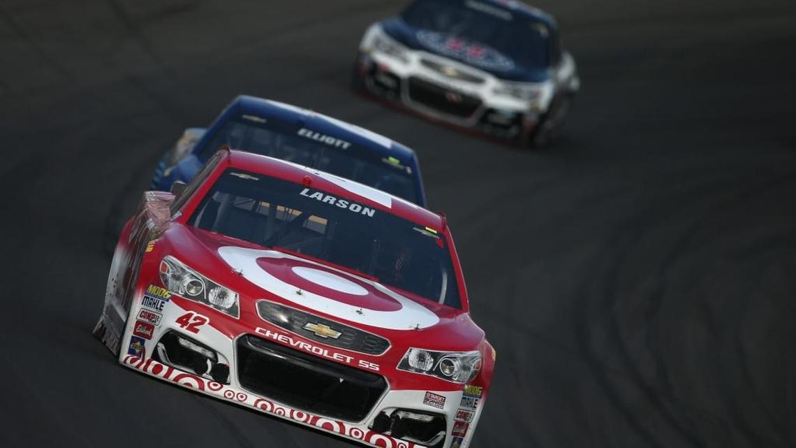 Kyle Larson leads Chase Elliott on Sunday during the Pure Michigan 400 at Michigan International Speedway in Brooklyn, Michigan.