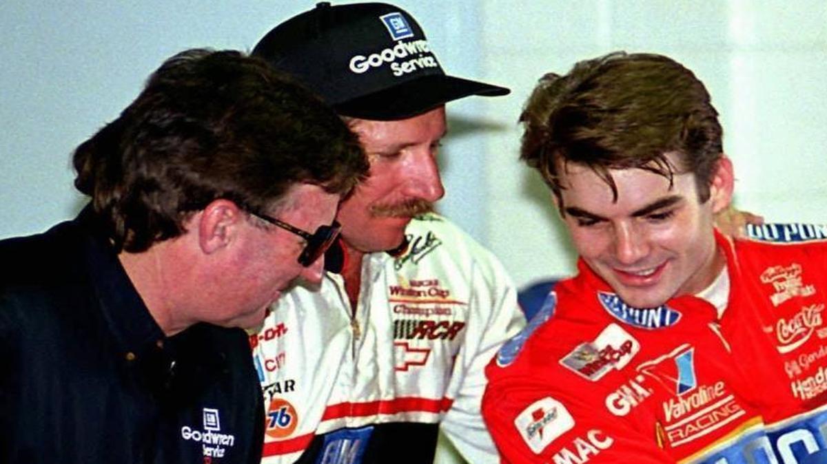 Richard Childress (left) talks to NASCAR drivers Dale Earnhardt (center) and Jeff Gordon in the garage area. Childress and Earnhardt won six titles together in a legendary pairing at the sport’s highest level.