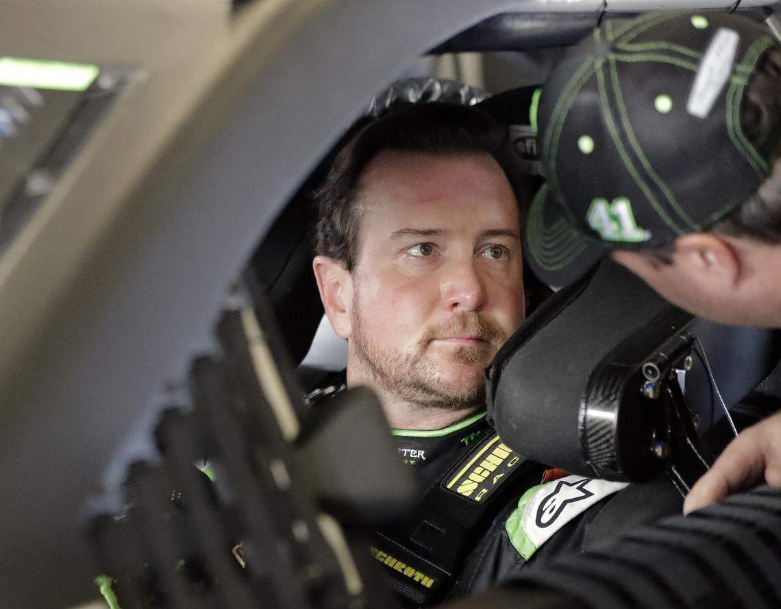 Kurt Busch’s visit to Camp Lejeune included joining a unit and actually taking part in some military drills. Above, Busch, left, talks with a crew member before a practice session at Daytona International Speedway in February.