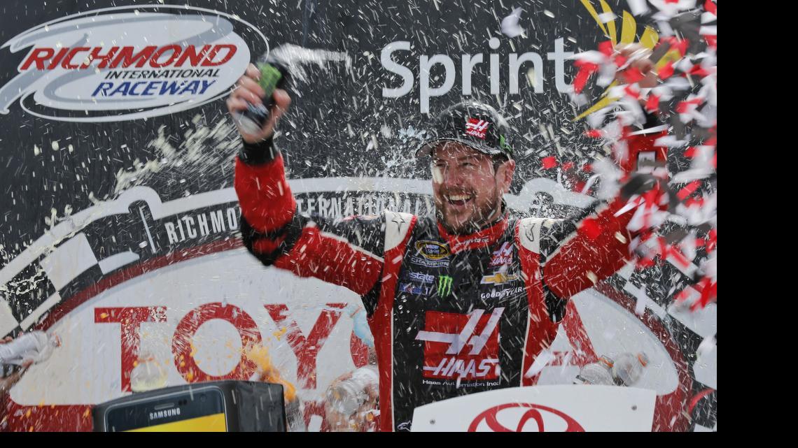
Kurt Busch celebrates after winning the NASCAR Sprint Cup auto race at Richmond International Raceway in Richmond, Va., Sunday, April 26, 2015. 
