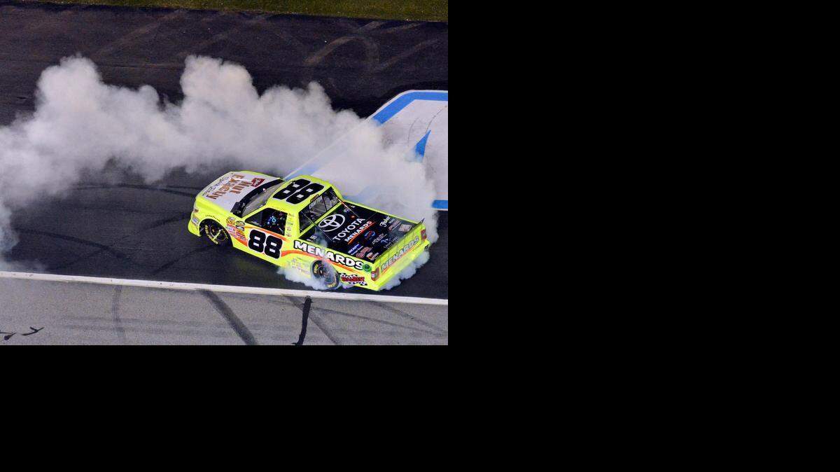 
Matt Crafton celebrates after winning the NASCAR Camping World Truck series auto race at Atlanta Motor Speedway Saturday, Feb. 28, 2015, in Hampton, Ga. 
