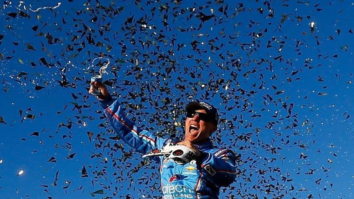 Kevin Harvick celebrates in Victory Lane after winning Sunday’s NASCAR Sprint Cup Series Bad Boy Off Road 300 at New Hampshire Motor Speedway.