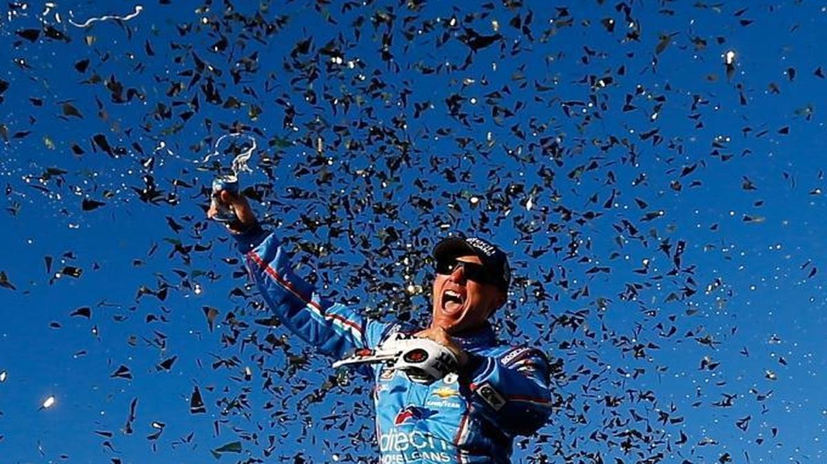 Kevin Harvick celebrates in Victory Lane after winning Sunday’s NASCAR Sprint Cup Series Bad Boy Off Road 300 at New Hampshire Motor Speedway.