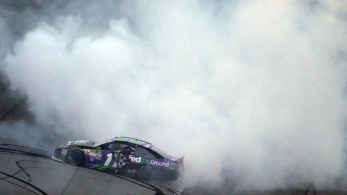 
Denny Hamlin celebrates with a burnout after winning Sunday’s NASCAR Sprint Cup Series myAFibRisk.com 400 at Chicagoland Speedway in Joliet, Ill.
