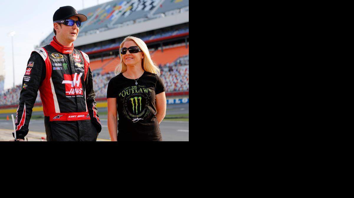 
 In this May 22, 2014, file photo, Kurt Busch, left, walks with Patricia Driscoll before qualifying for a NASCAR Sprint Cup series auto race at Charlotte Motor Speedway in Concord.

