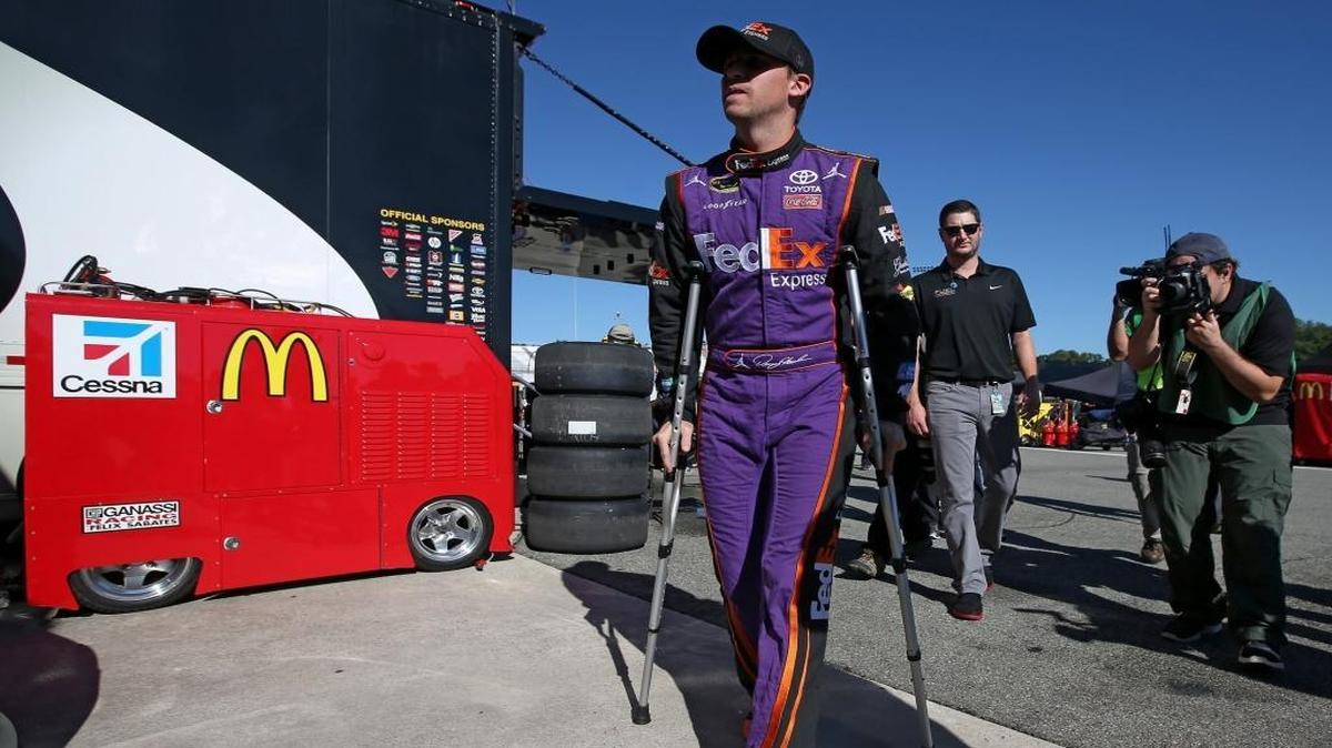 
Denny Hamlin was on crutches Friday at Richmond International Raceway after hurting his knee earlier in the week playing basketball.
