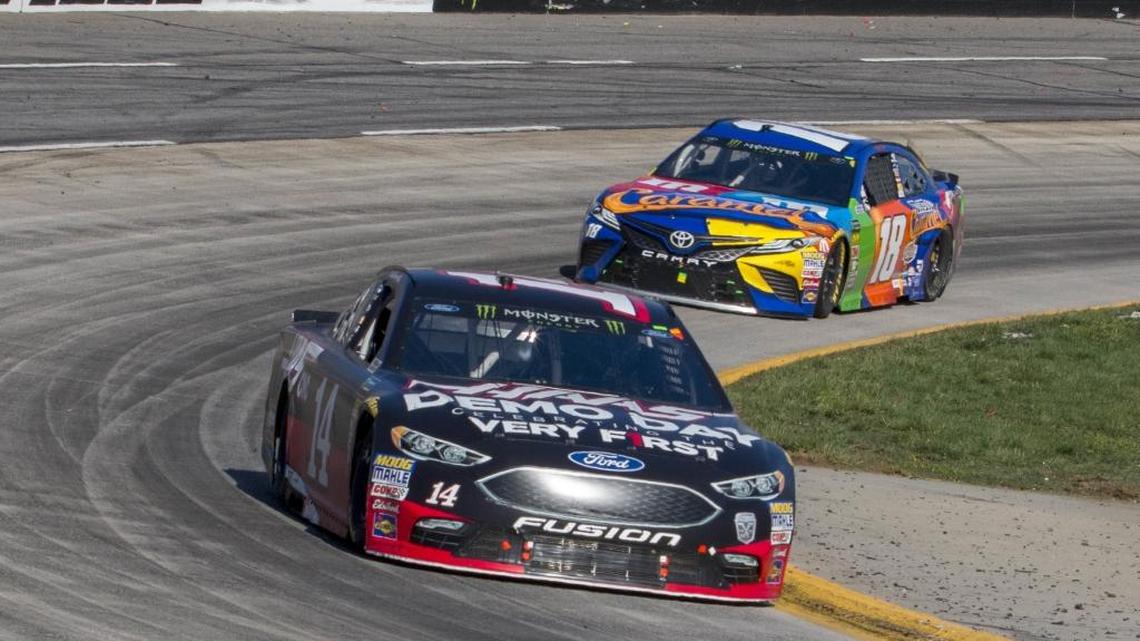 Clint Bowyer (14) was a little bit better, but Kyle Busch (18) finished second for the third time this season on Monday, at Martinsville Speedway in Martinsville, Va.