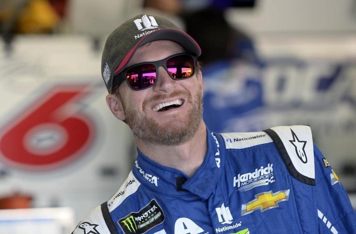 Monster Energy NASCAR Cup Series driver Dale Earnhardt Jr. (88) laughs while standing near his car prior to the start of practice for the Bank of America 500 at Charlotte Motor Speedway on Friday, October 6, 2017.