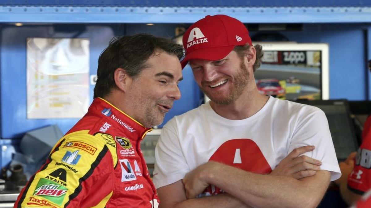 Dale Earnhardt Jr., right, shares a laugh with Jeff Gordon in the garage area Friday at Watkins Glen International during practice for Sunday's NASCAR Sprint Cup Series auto race in Watkins Glen, N.Y. Gordon came out of retirement to fill in for Earnhardt.